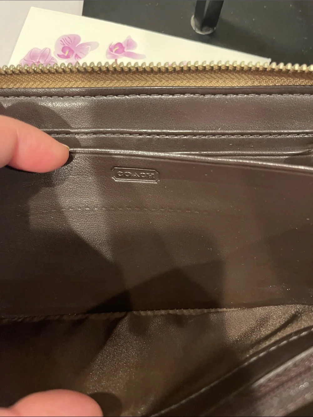 Coach Ashley perforated zip-around wallet.